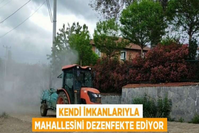 KENDİ İMKANLARIYLA MAHALLESİNİ DEZENFEKTE EDİYOR