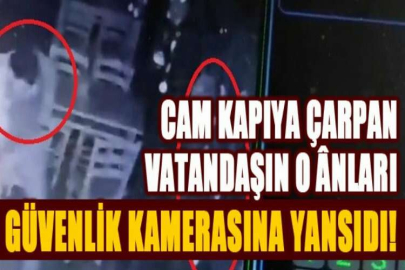 Cam kapıya çarpan vatandaşın o ânları güvenlik kamerasına yansıdı