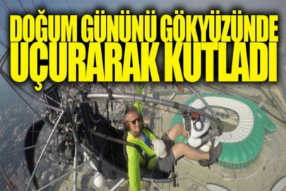 Köpeğinin doğum gününü gökyüzünde uçurarak kutladı