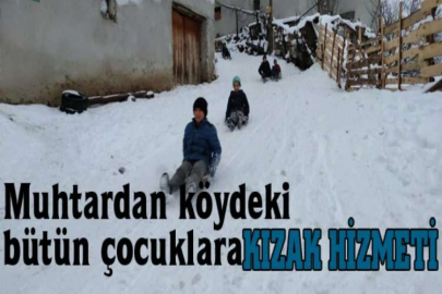 Muhtardan köydeki bütün çocuklara kızak hizmeti