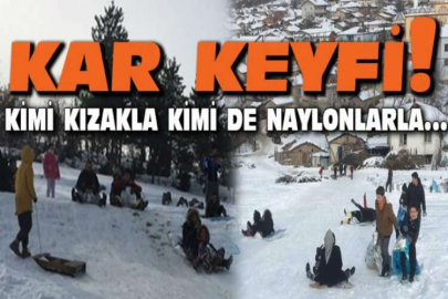 Tahta kızak ve naylonlarla kar keyfi