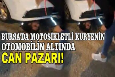 Bursa'da motosikletli kuryenin otomobilin altında can pazarı...