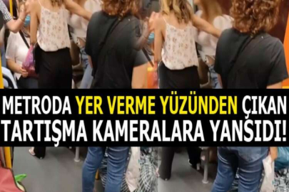 Metroda yer verme yüzünden çıkan tartışma kameralara yansıdı