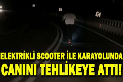 Elektrikli scooter ile karayolunda canını tehlikeye atarak giden genç kameralarda